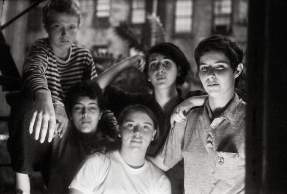 Black and white photograph of a group ofpeople posing for the camera.