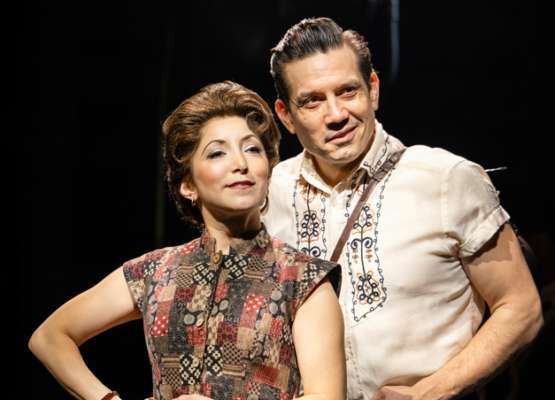 The Ballad of Johnny and June – Wycombe Swan, High Wycombe Two actors in vintage costumes stand close together on stage, with one looking confident and the other smiling slightly.
