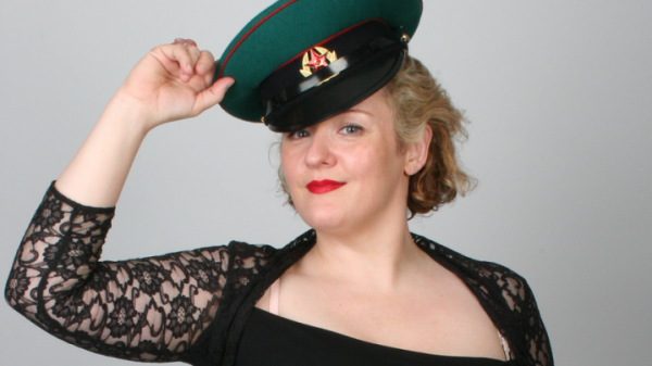 Woman wearing lacy top and Russian military cap