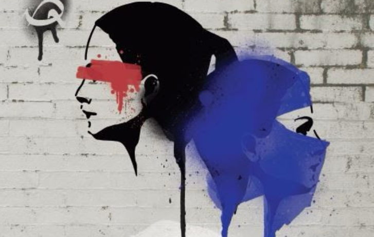 two womens heads spray painted on a wall